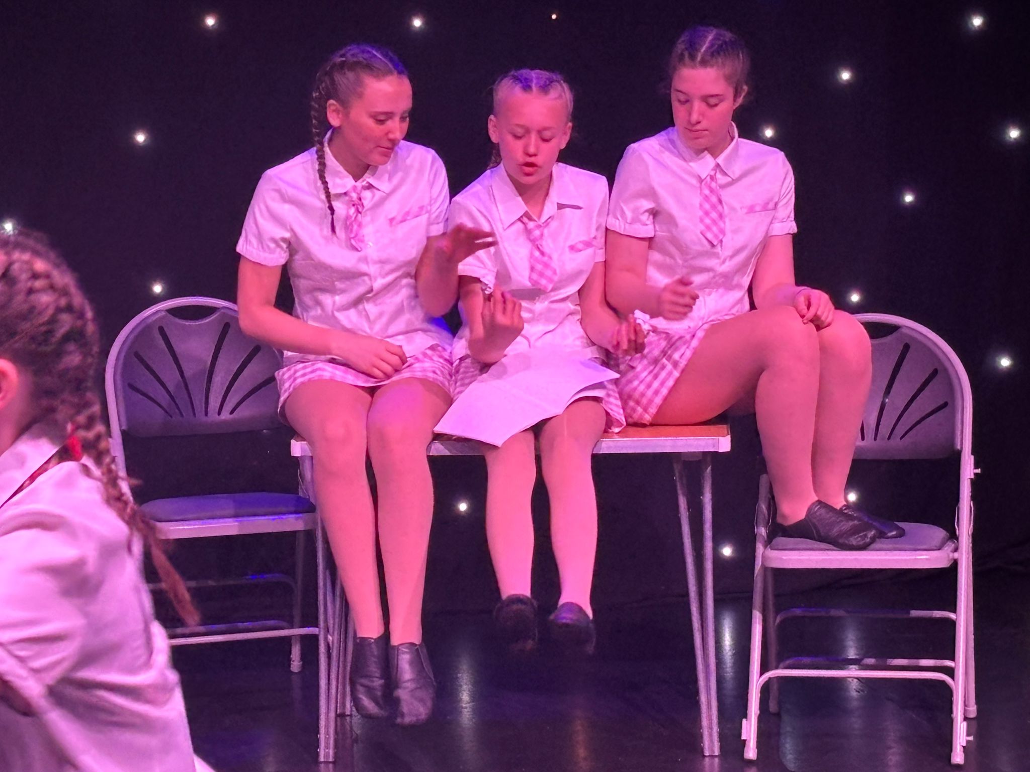 Acro dancers holding balance pose during performance