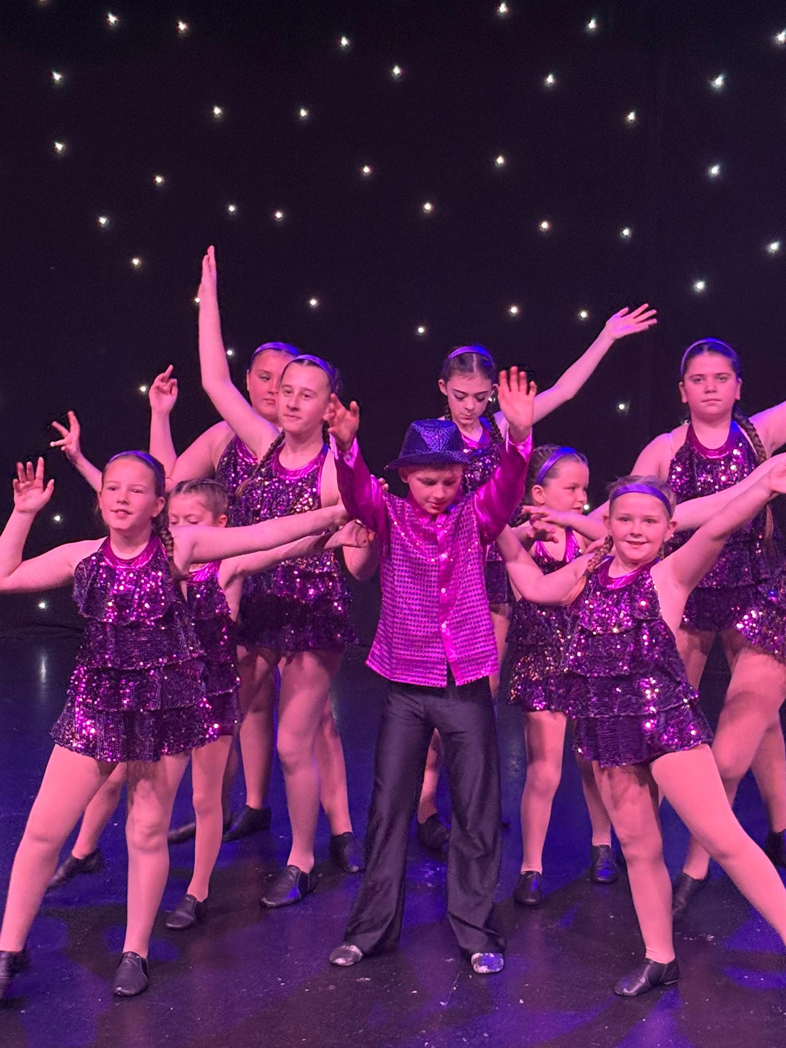 Jazz group performing under purple lighting